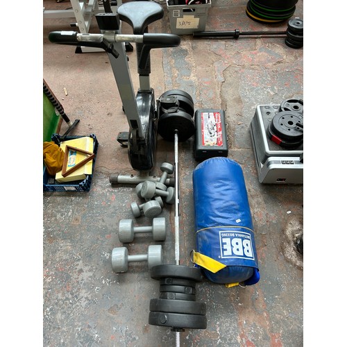 830 - A collection of fitness equipment to include dumbbells, barbell with weights, cased York Fitness 15k... 