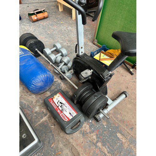 830 - A collection of fitness equipment to include dumbbells, barbell with weights, cased York Fitness 15k... 