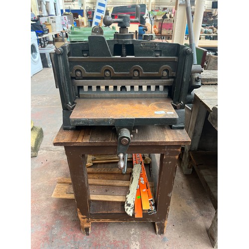 956 - A vintage pine two tier workbench with mounted T.C. Thompson & Son Ltd. of Manchester cast iron indu... 