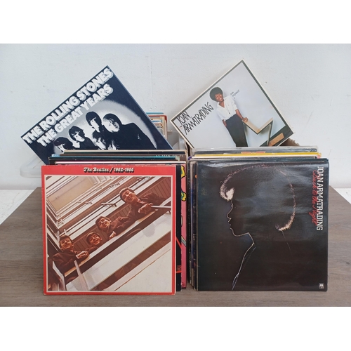 647 - Two boxes containing a collection LP vinyl records to include Elvis Presley, The Jam, Queen, The Bea... 