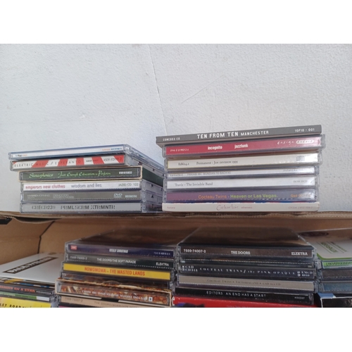 648 - A box containing a collection of CDs to include The Velvet Underground, Paul Weller, Cocteau Twins, ... 