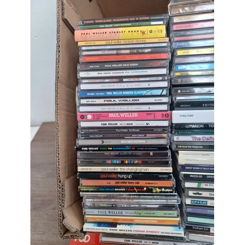 648 - A box containing a collection of CDs to include The Velvet Underground, Paul Weller, Cocteau Twins, ... 