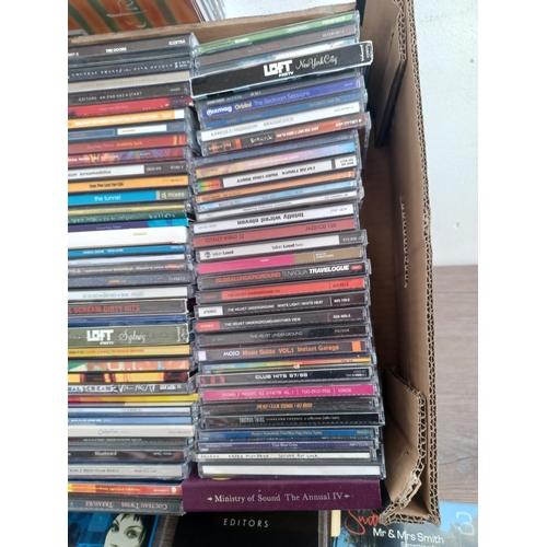 648 - A box containing a collection of CDs to include The Velvet Underground, Paul Weller, Cocteau Twins, ... 