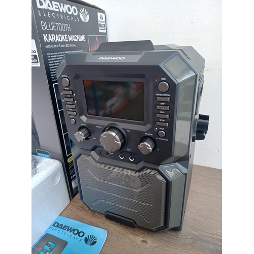 657 - A boxed Daewoo Bluetooth Karaoke machine