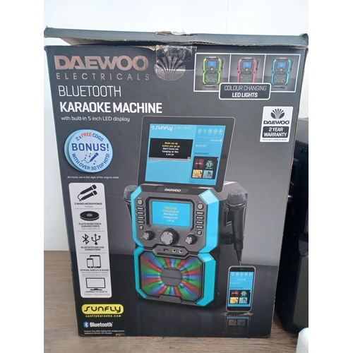 657 - A boxed Daewoo Bluetooth Karaoke machine