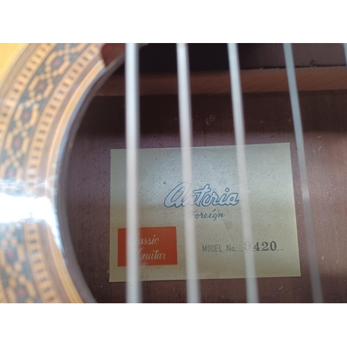 661 - Two classical guitars incorrectly strung with steel strings