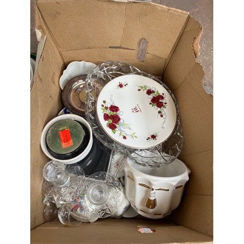 972B - Six boxes containing ceramics, glassware, Lilliput Lane cottages, cutlery etc.