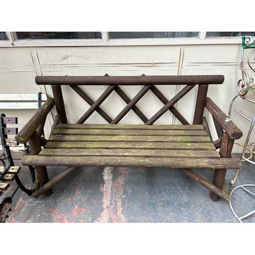 848 - A modern brown painted wooden garden bench