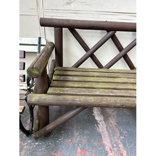 848 - A modern brown painted wooden garden bench