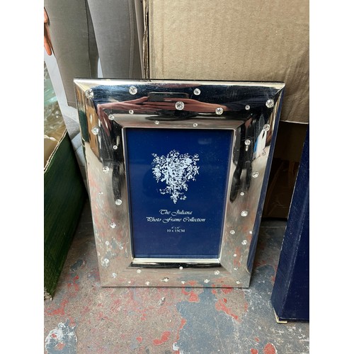 970C - A collection of house clearance items to include boxed Julian silver plated photo frame, framed prin... 