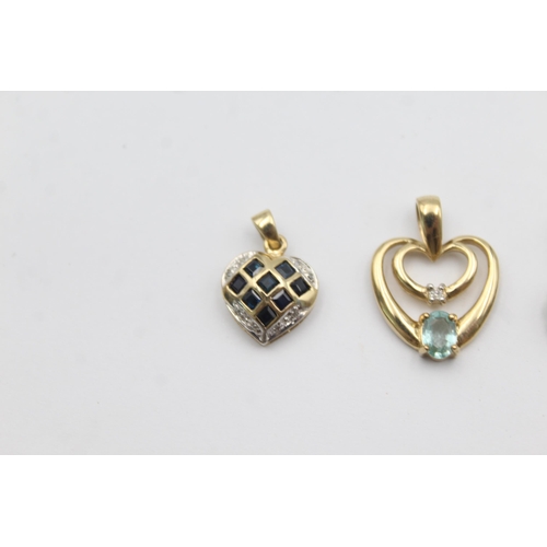 1002 - Three 9ct gold gemstone and diamond pendants, two sapphire and one blue gemstone - approx. gross wei... 