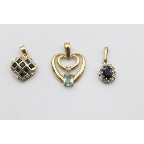 1002 - Three 9ct gold gemstone and diamond pendants, two sapphire and one blue gemstone - approx. gross wei... 