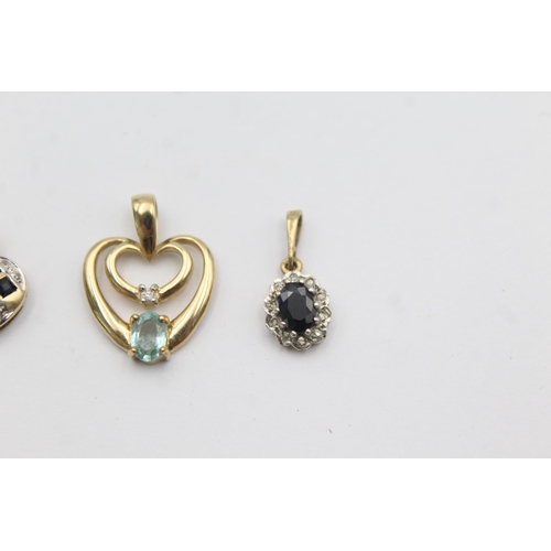 1002 - Three 9ct gold gemstone and diamond pendants, two sapphire and one blue gemstone - approx. gross wei... 