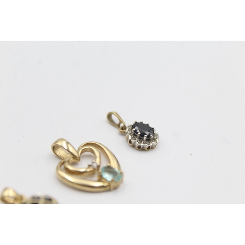 1002 - Three 9ct gold gemstone and diamond pendants, two sapphire and one blue gemstone - approx. gross wei... 