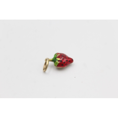 1003 - A 9ct gold enamel strawberry charm pendant - approx. gross weight 0.6 grams