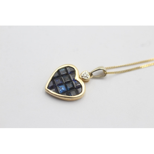 1010 - A 9ct gold diamond and sapphire inlay heart frame pendant necklace - approx. gross weight 2.4 grams