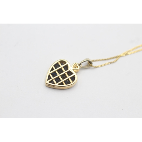 1010 - A 9ct gold diamond and sapphire inlay heart frame pendant necklace - approx. gross weight 2.4 grams