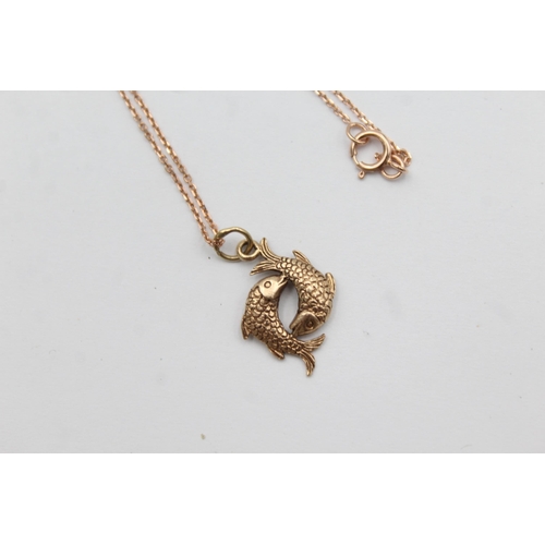 1017 - A 9ct rose gold Pisces fish pendant necklace - approx. gross weight 2 grams