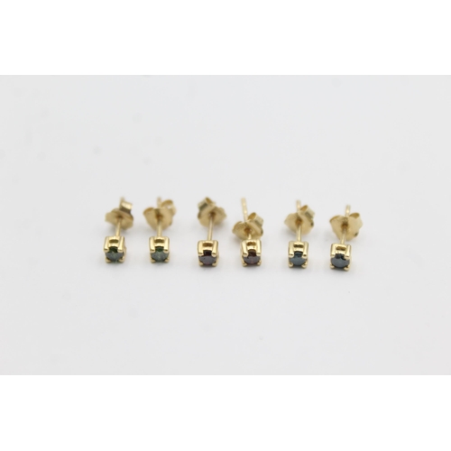 1019 - Three pairs of 9ct gold enhanced coloured diamond stud earrings - approx. gross weight 1.4 grams