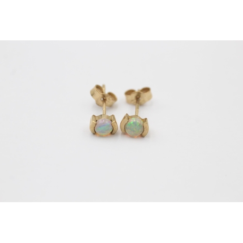 1027 - Three pairs of 9ct gold opal earrings - approx. gross weight 3.2 grams