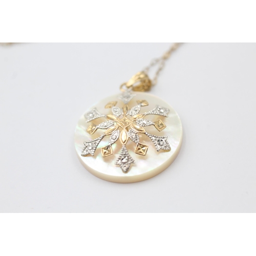 1030 - A 10ct yellow and white gold mother of pearl pendant necklace - approx. gross weight 4 grams