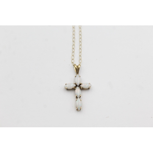 1034 - A 9ct gold opal cross pendant necklace - approx. gross weight 1.4 grams and 20.5cm long when fastene... 