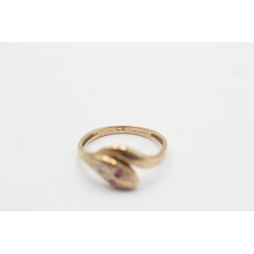 1054 - A 9ct gold diamond and ruby snake ring - approx. gross weight 1.7 grams