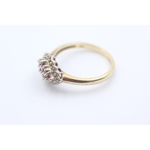 1059 - A 9ct gold ruby and diamond cluster dress ring - approx. gross weight 2.7 grams