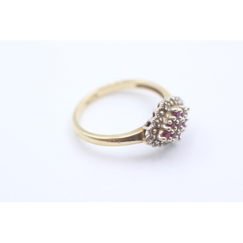 1059 - A 9ct gold ruby and diamond cluster dress ring - approx. gross weight 2.7 grams