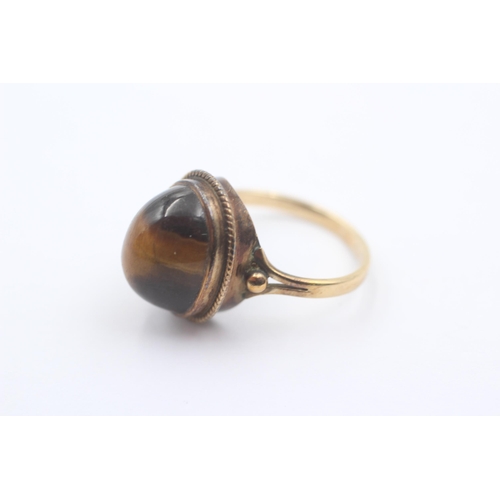 1064 - A 9ct gold tiger's eye statement ring - approx. gross weight 3.5 grams