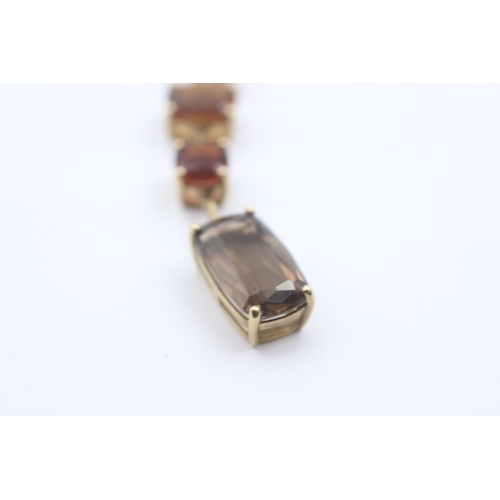 1066 - A 9ct gold smoky quartz and citrine pendant necklace - approx. gross weight 3.4 grams