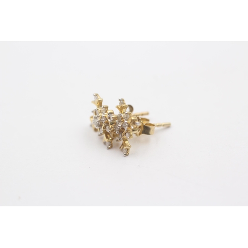 1068 - A pair of 9ct gold diamond snowflake cluster earrings - approx. gross weight 1.8 grams