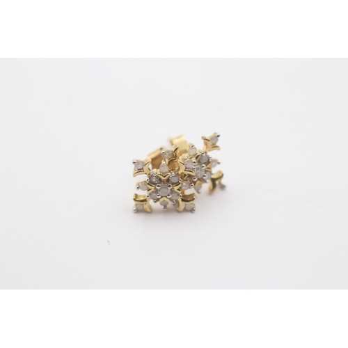 1068 - A pair of 9ct gold diamond snowflake cluster earrings - approx. gross weight 1.8 grams