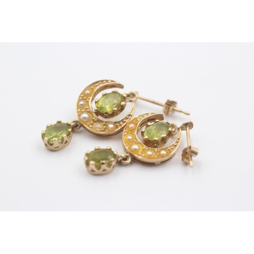 1079 - A pair of 9ct gold peridot and pearl crescent moon drop earrings - approx. gross weight 3.4 grams