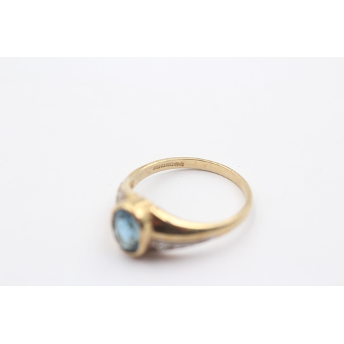 1084 - A 9ct gold blue topaz and diamond dress ring - approx. gross weight 2.8 grams