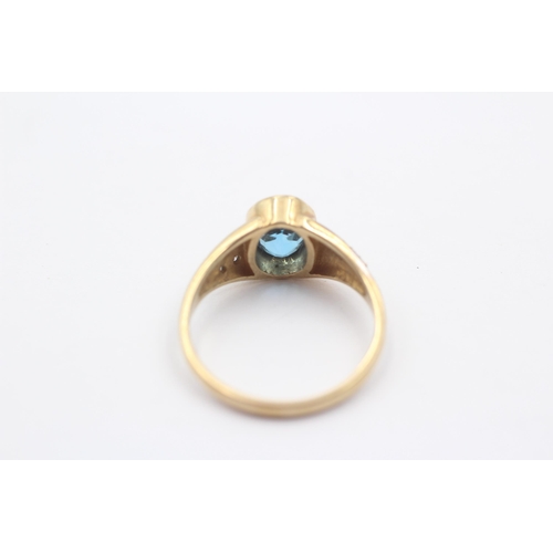 1084 - A 9ct gold blue topaz and diamond dress ring - approx. gross weight 2.8 grams