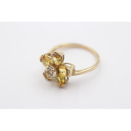 1085 - A 9ct gold white gemstone and synthetic yellow sapphire floral statement ring - approx. gross weight... 