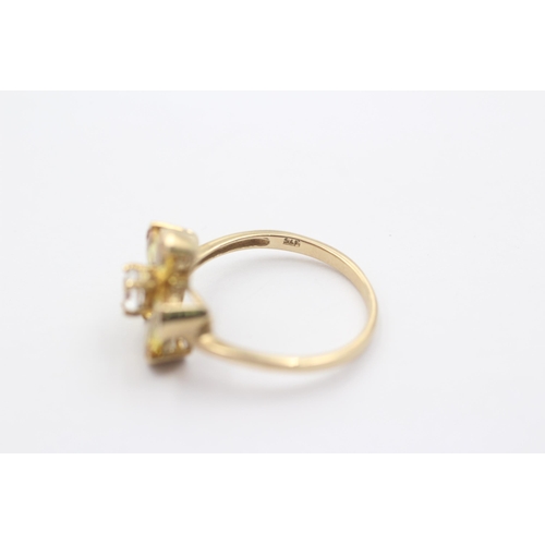 1085 - A 9ct gold white gemstone and synthetic yellow sapphire floral statement ring - approx. gross weight... 