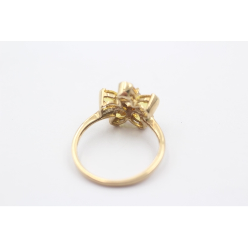 1085 - A 9ct gold white gemstone and synthetic yellow sapphire floral statement ring - approx. gross weight... 