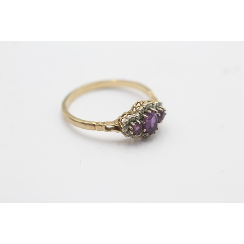 1087 - A 9ct gold amethyst and diamond triple stone halo dress ring - approx. gross weight 2.1 grams