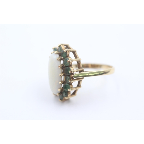 1088 - A 9ct gold opal and emerald halo statement ring - approx. gross weight 3.9 grams