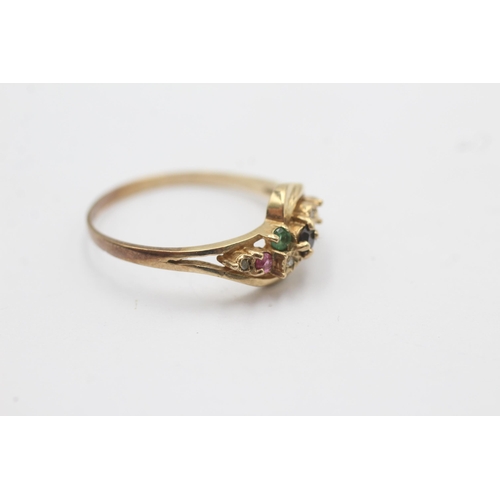 1089 - A 9ct gold ruby, sapphire, emerald and diamond stylised twist setting ring - approx. gross weight 2.... 