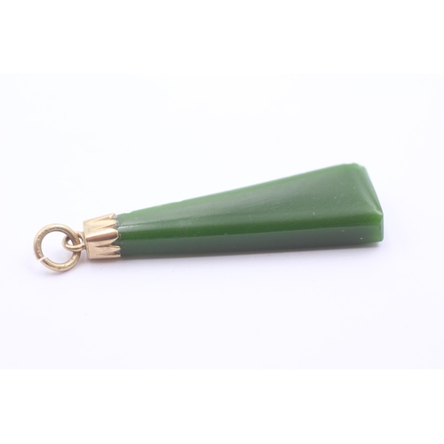 1103 - A 6ct gold green paste pendant - approx. gross weight 5.9 grams