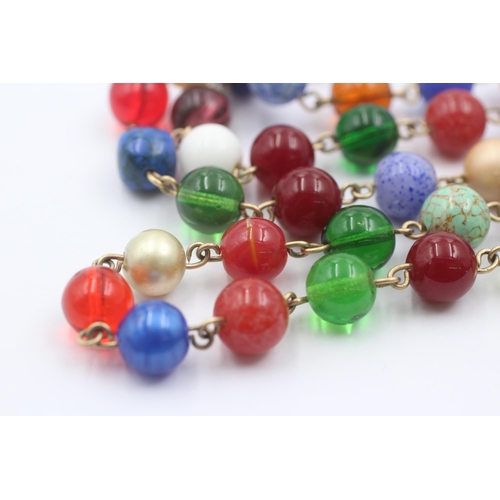 1107 - A 9ct gold multi-coloured glass beads single strand necklace - approx. gross weight 79.1 grams