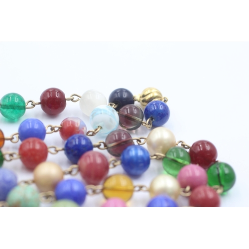 1107 - A 9ct gold multi-coloured glass beads single strand necklace - approx. gross weight 79.1 grams