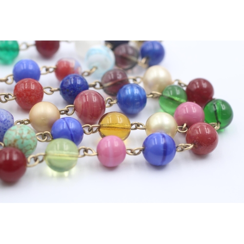 1107 - A 9ct gold multi-coloured glass beads single strand necklace - approx. gross weight 79.1 grams