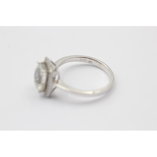 1111 - A 9ct white gold rock quartz and diamond halo dress ring - approx. gross weight 2.5 grams