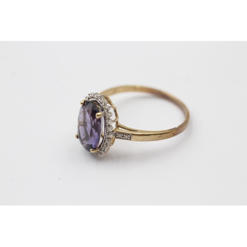 1113 - A 9ct gold amethyst and diamond halo dress ring - approx. gross weight 2.7 grams