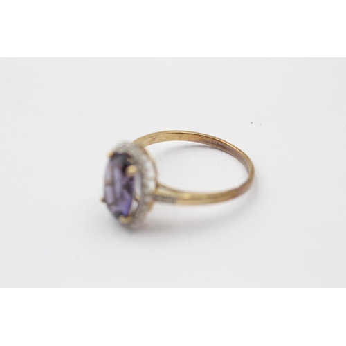 1113 - A 9ct gold amethyst and diamond halo dress ring - approx. gross weight 2.7 grams