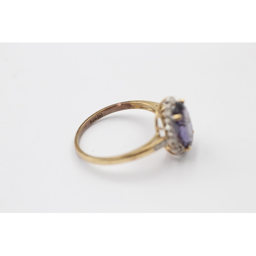 1113 - A 9ct gold amethyst and diamond halo dress ring - approx. gross weight 2.7 grams